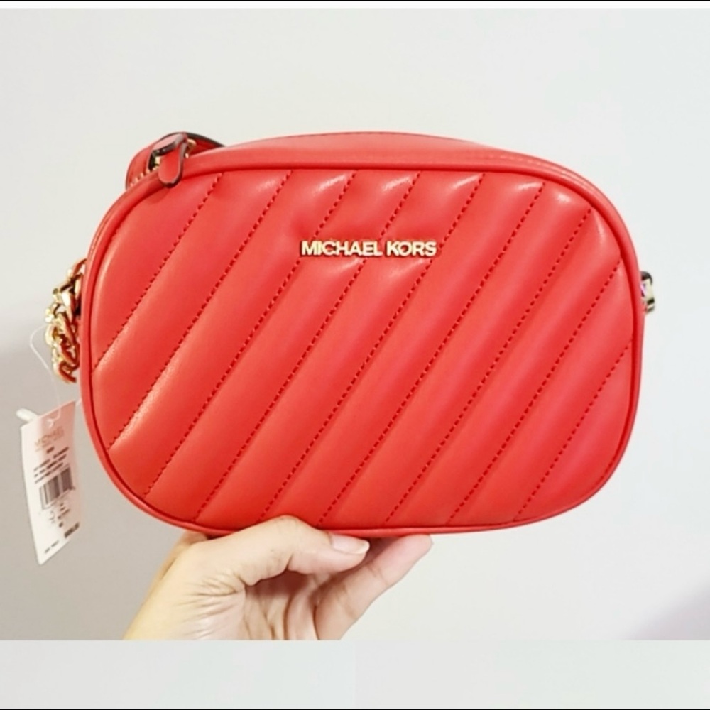 Micheal Kors Oval Quilted crossbody.